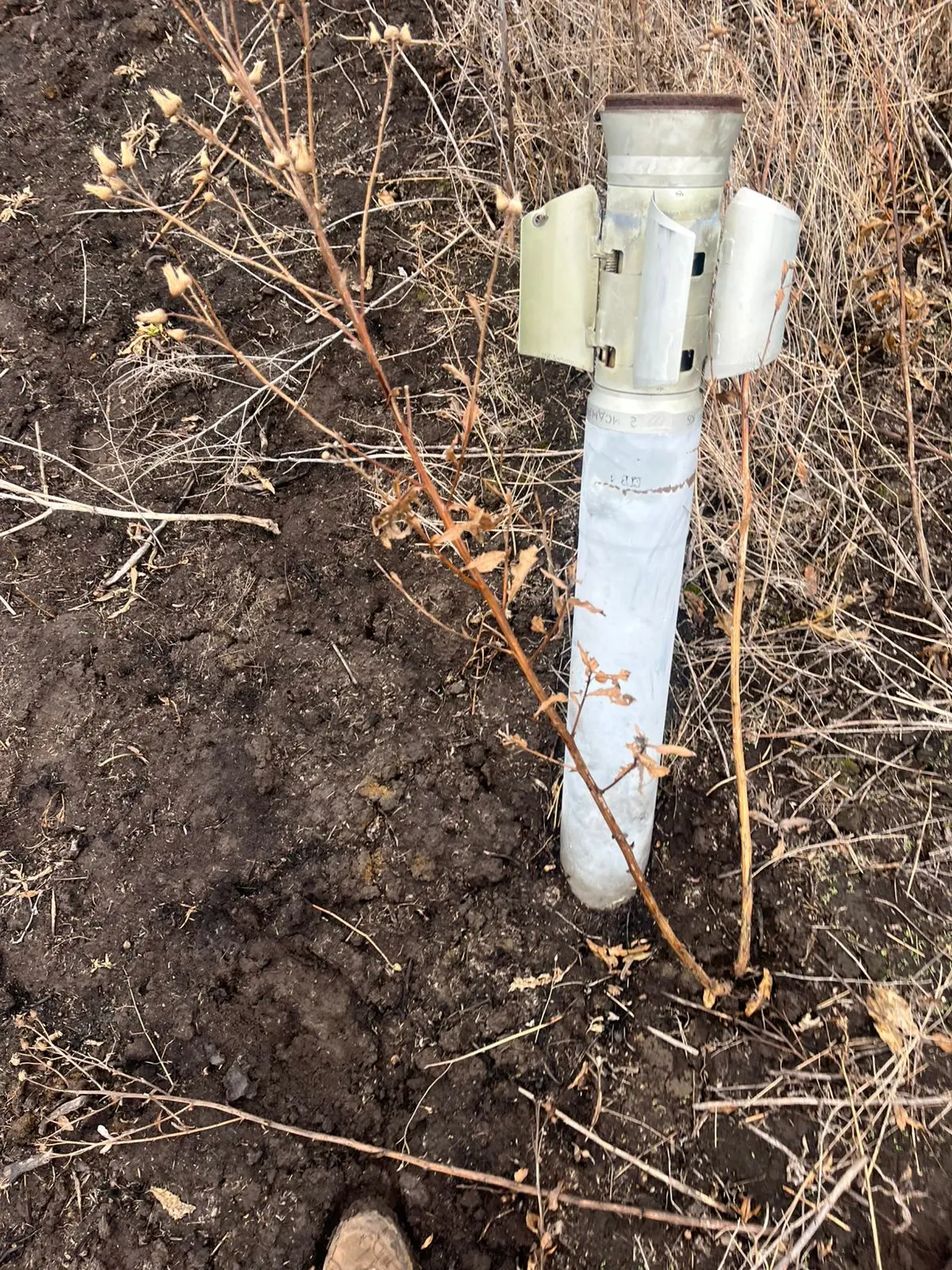 Unexploded shell in the ground